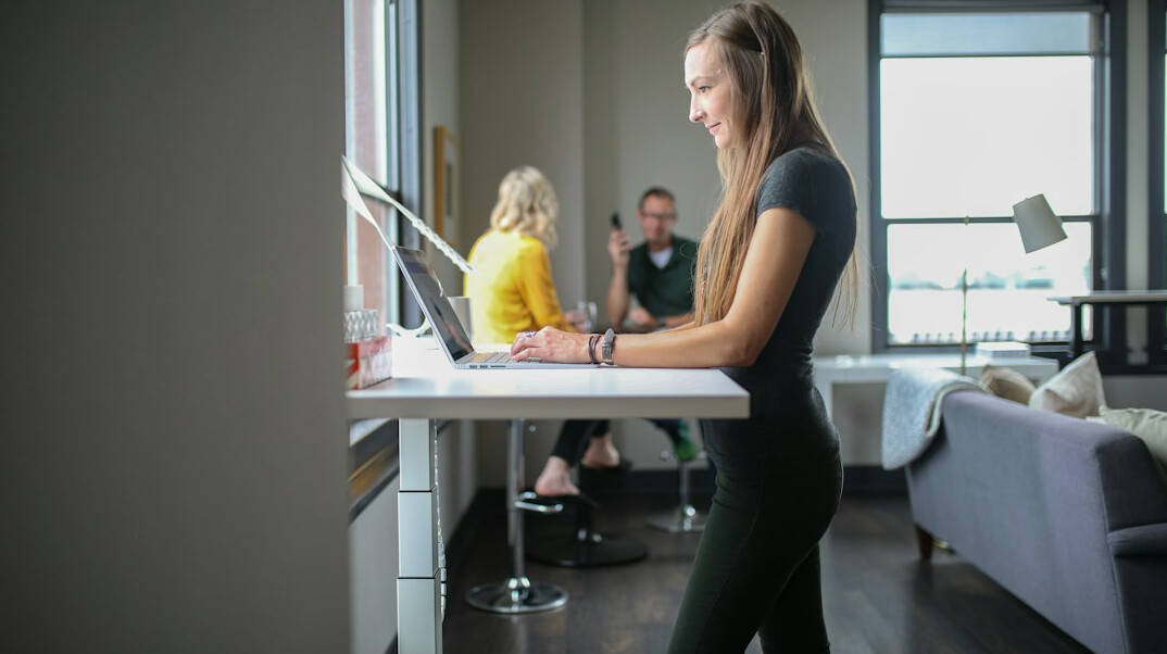 employee using standing desk